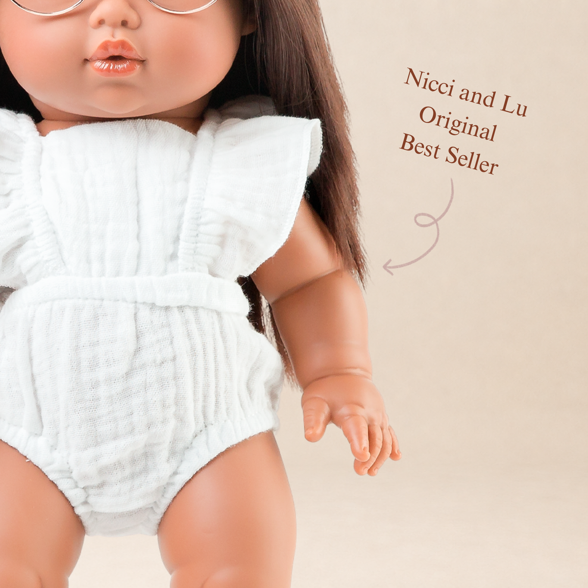 Close-up of the Flutter Romper in Ivory highlighting the flutter sleeves and gathered bodice 34-38cm doll clothing.