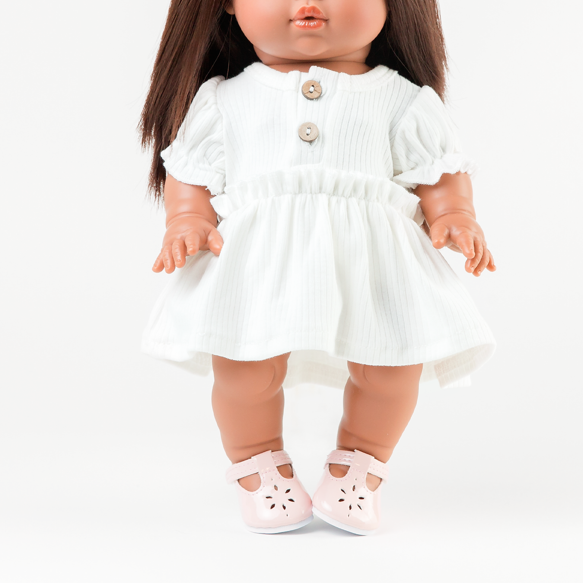 34cm Mini Colettos brunette doll Isabel standing in ivory puff sleeve dress with wooden button detail by Nicci and Lu for 34-38cm dolls.