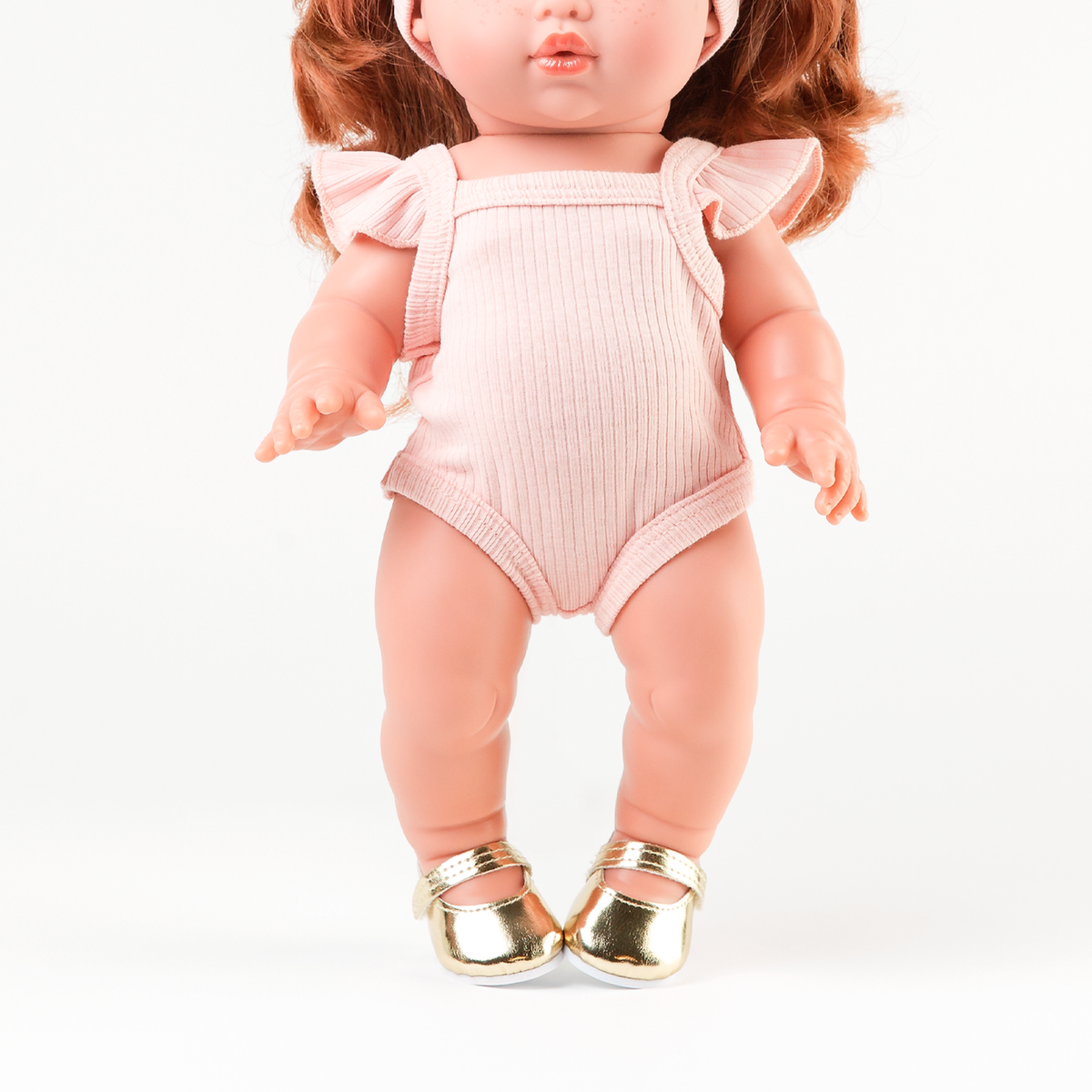 Mini Colettos Sophia wearing the Rose Pink Flutter Singlet Romper with Gold Mary Jane Shoes.
