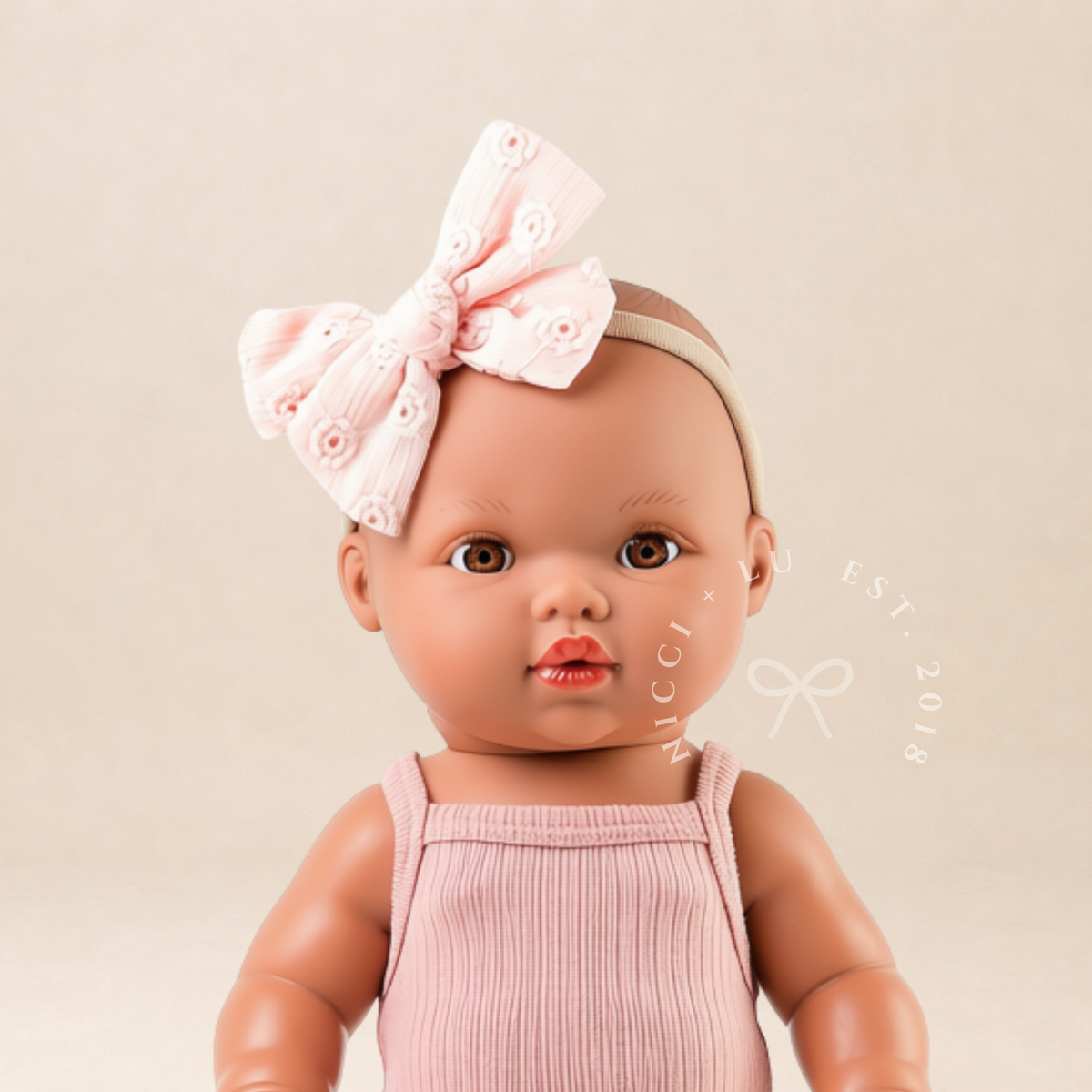 34cm Mini Colettos Alba doll wearing singlet bodysuit in Rose Blush with pink bow - Nicci and Lu 34-38cm doll clothing and outfits.