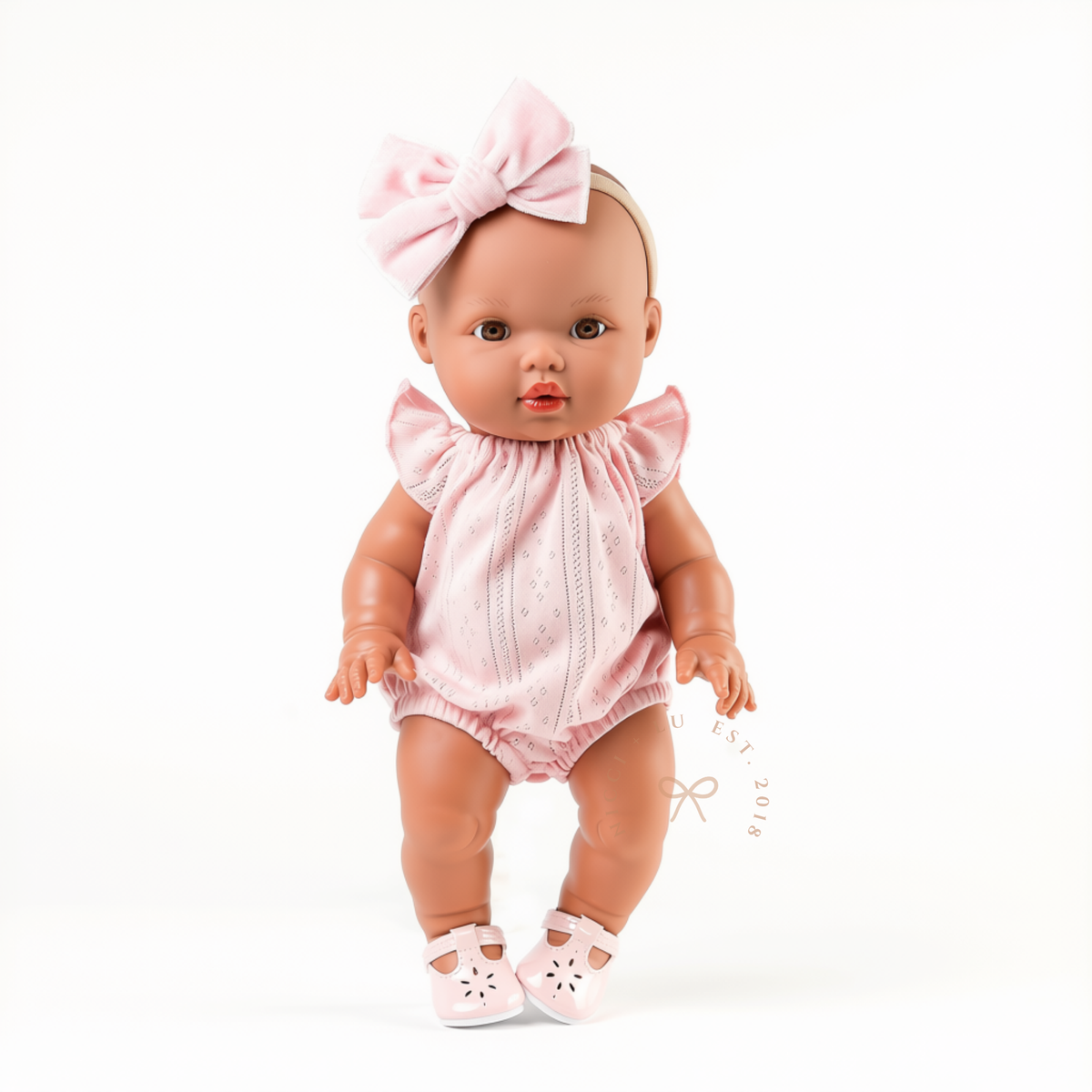 Mini Colettos Alba wearing the Willow Pointelle Romper in Pink with Soft Pink Mary Jane Shoes by Nicci and Lu.