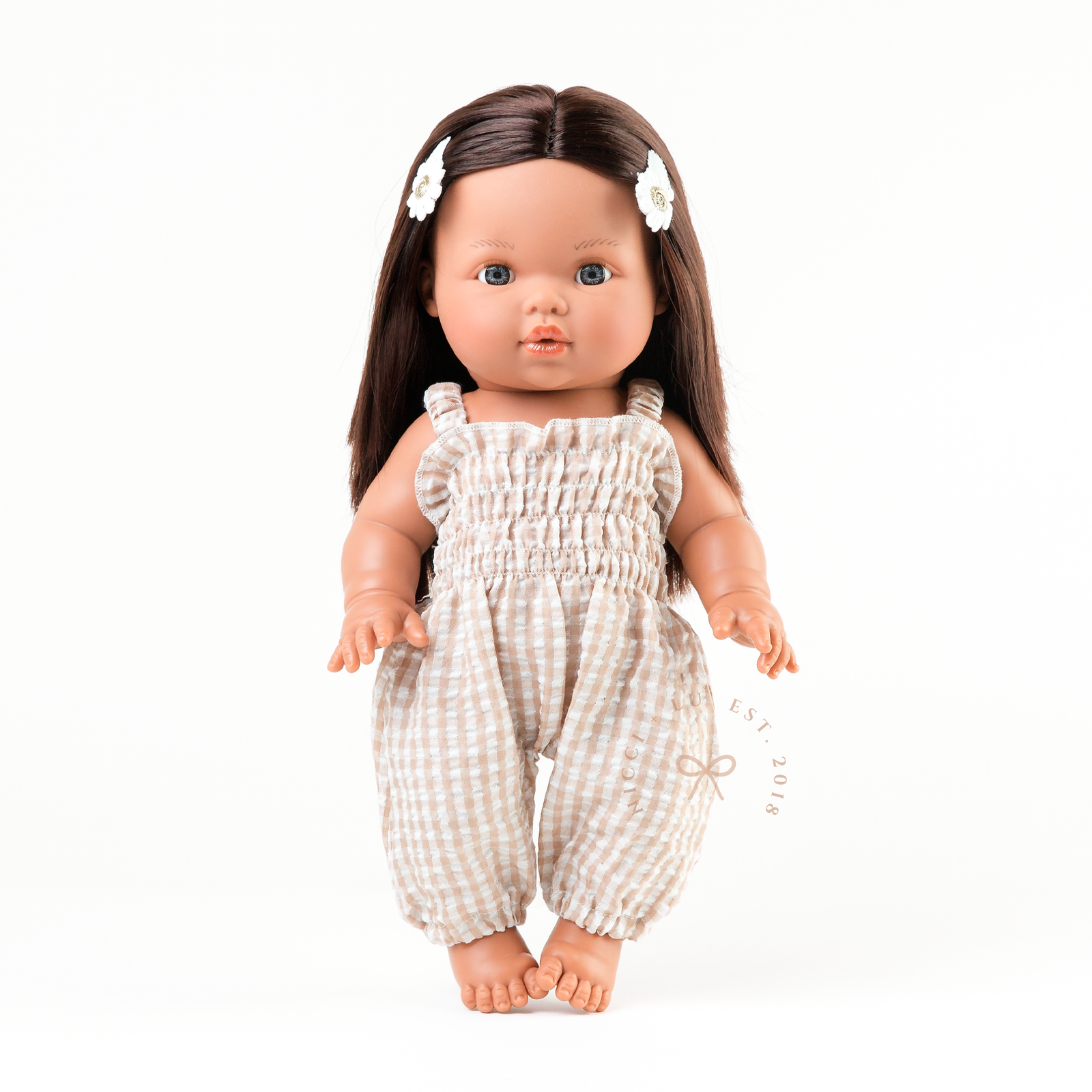 Flat lay of a smocked gingham jumpsuit outfit for 34cm dolls.