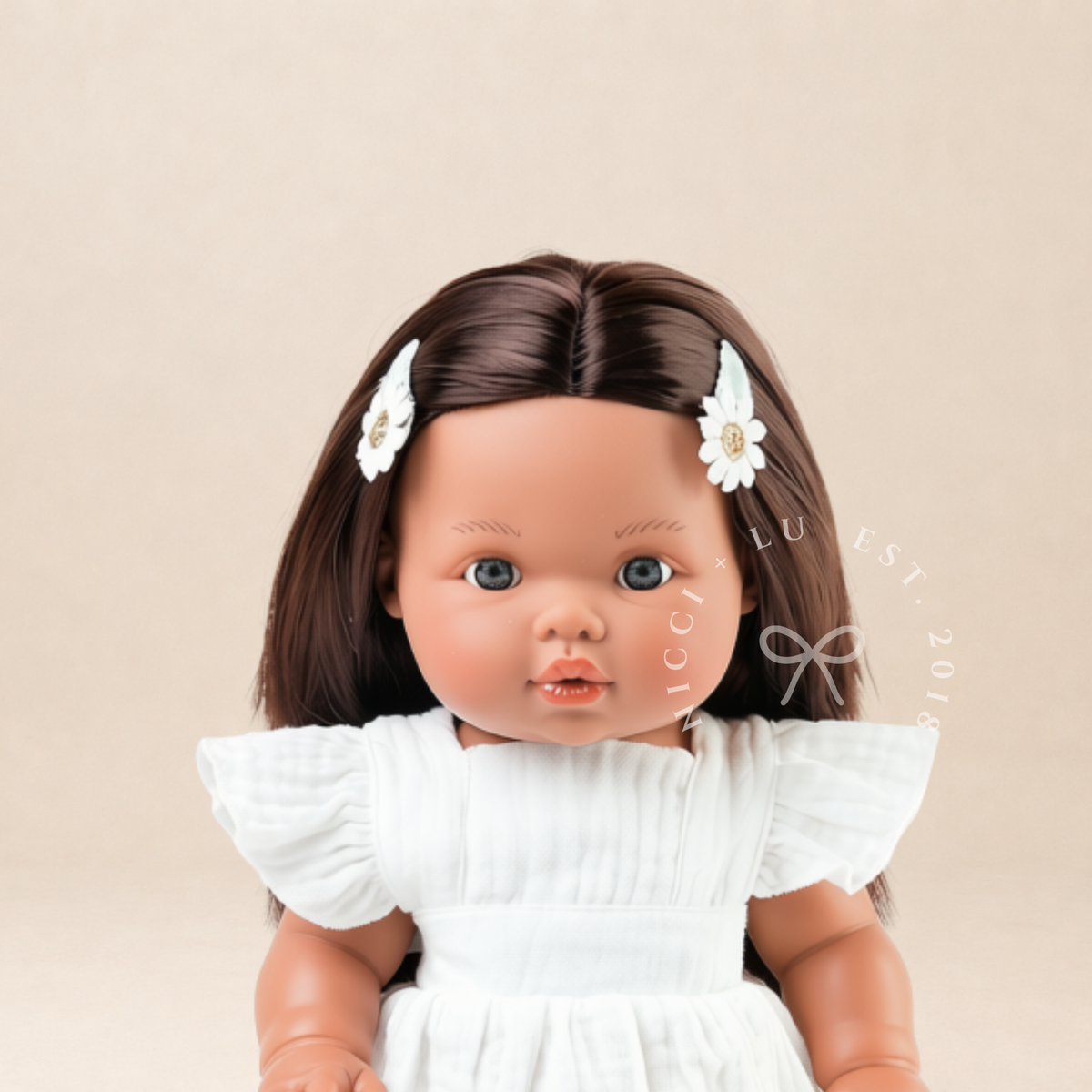 Mini Colettos Isabel doll modelling the Ivory Pippa Apron Dress designed for 34-38cm dolls.