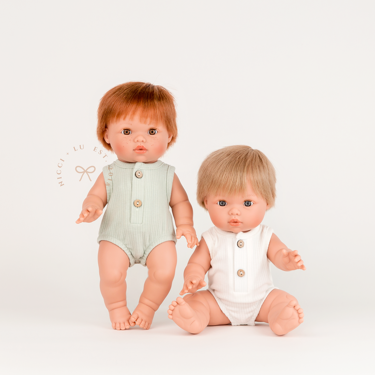 Mini Colettos Jasper and Oliver wearing Sage Green and Ivory Bubble Rompers for 34-38cm dolls.