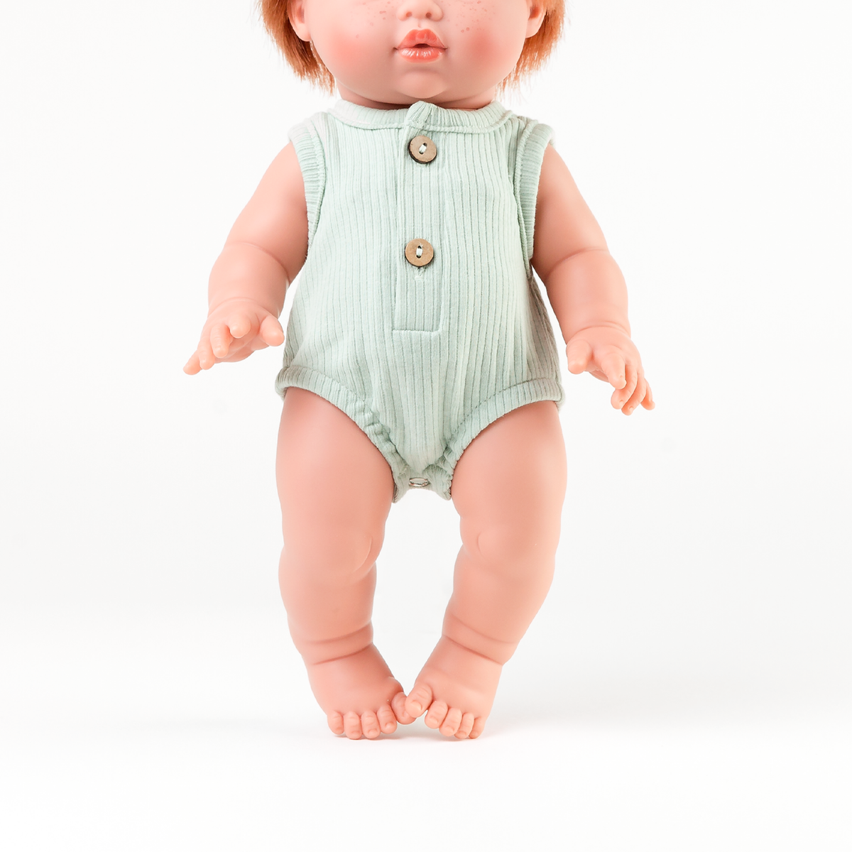 Mini Colettos Jasper wearing a Sage Green Ribbed Bubble Romper for 34-38cm dolls.