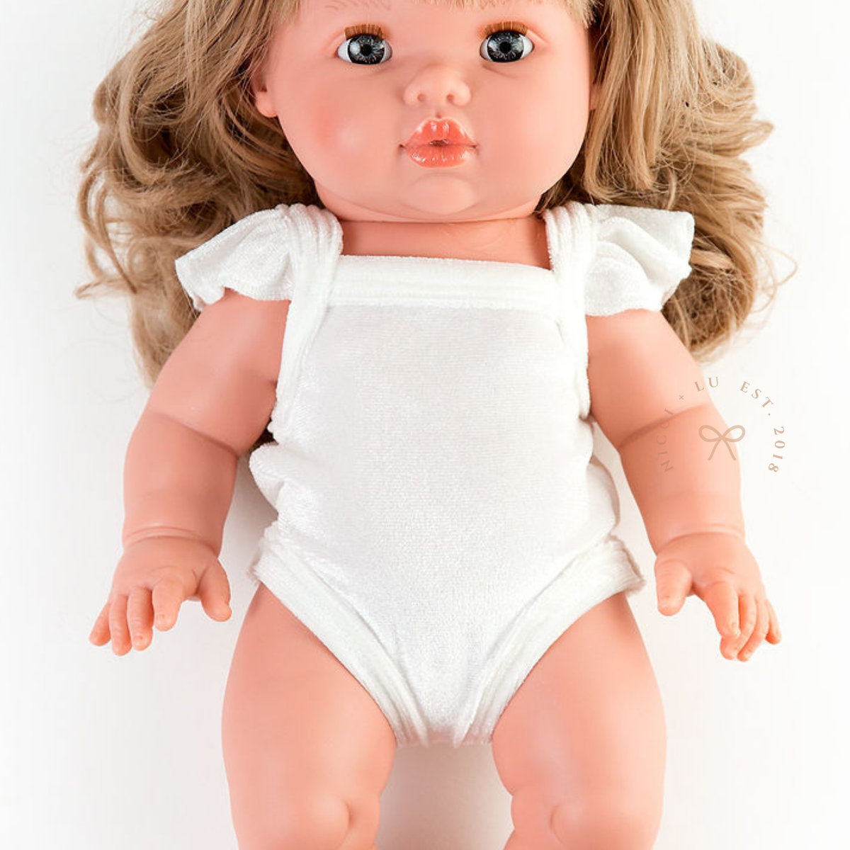 Mini Colettos Kate wearing the Ivory Frilled Velvet Singlet Bodysuit.