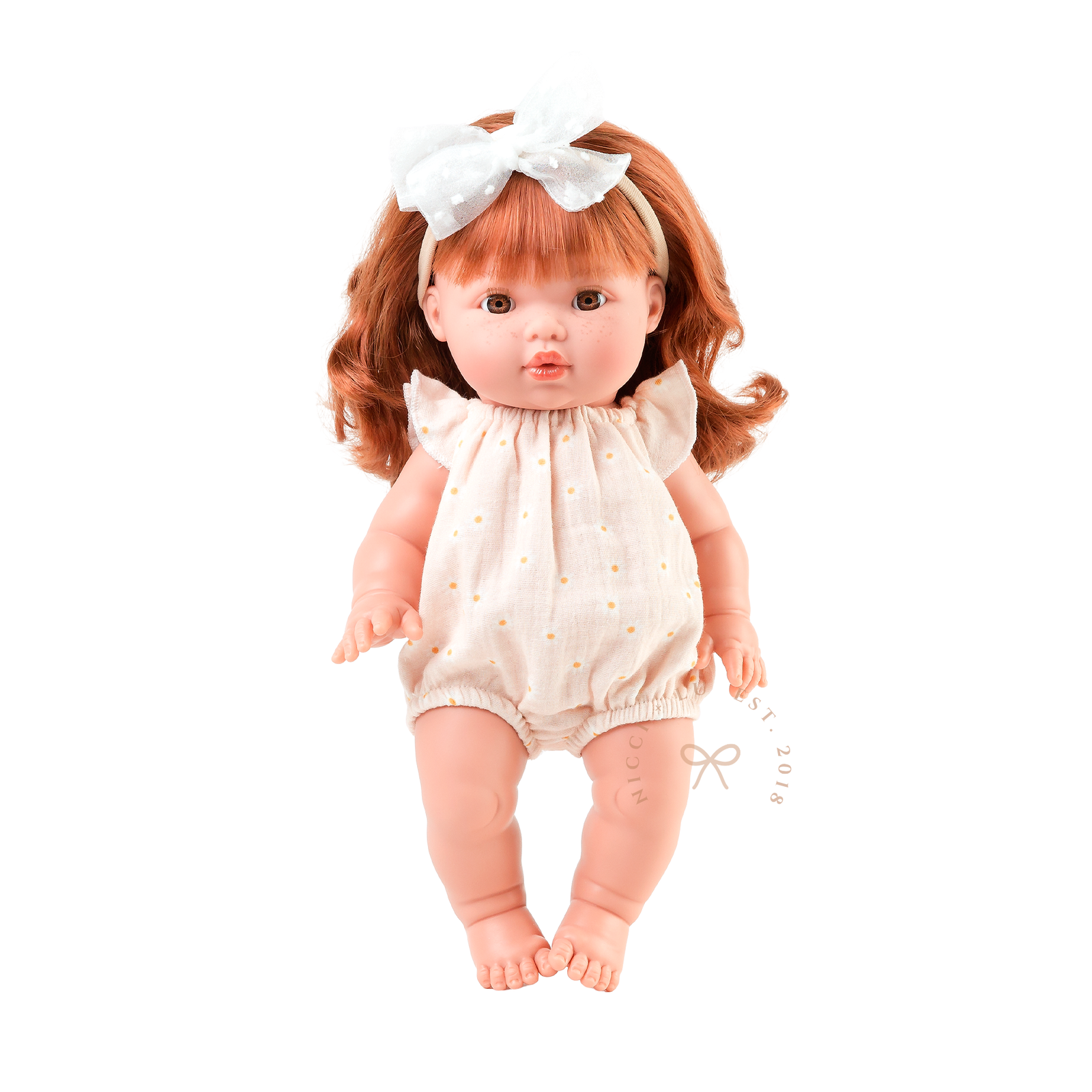 34cm Mini Colettos Sophia wearing the Willow Muslin Romper in Daisy Print by Nicci and Lu.
