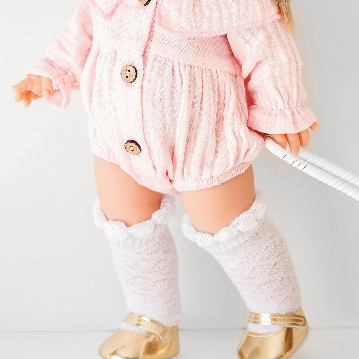 34cm Minikane doll in Daisy Muslin Playsuit styled with knee-high socks and gold maru jane shoes by Nicci and Lu made for pretend play.