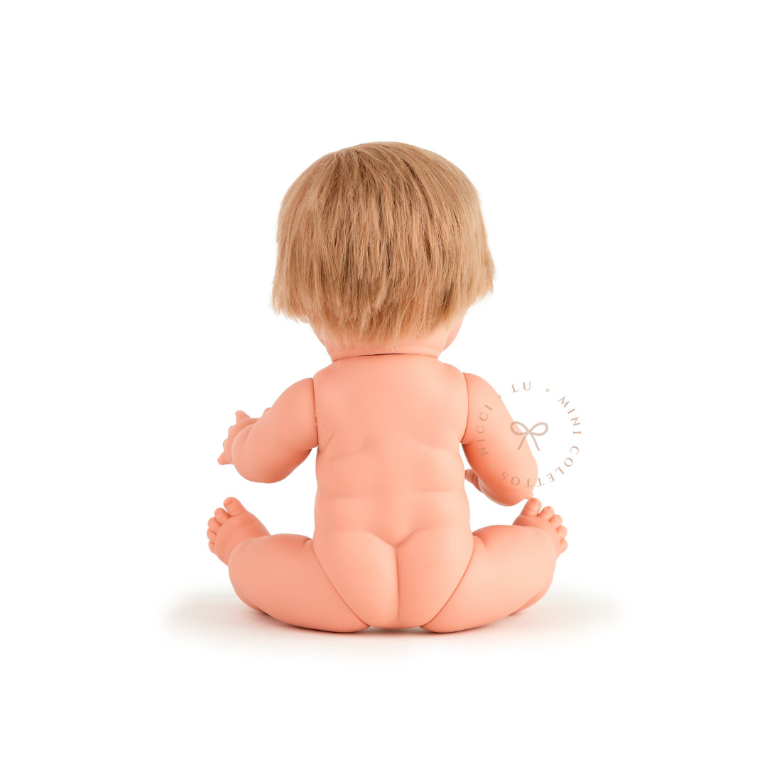 The back view of Oliver showcases his neatly styled short blonde hair and anatomically correct doll design. This photograph provides a clear view of the 34cm Mini Colettos doll from behind.