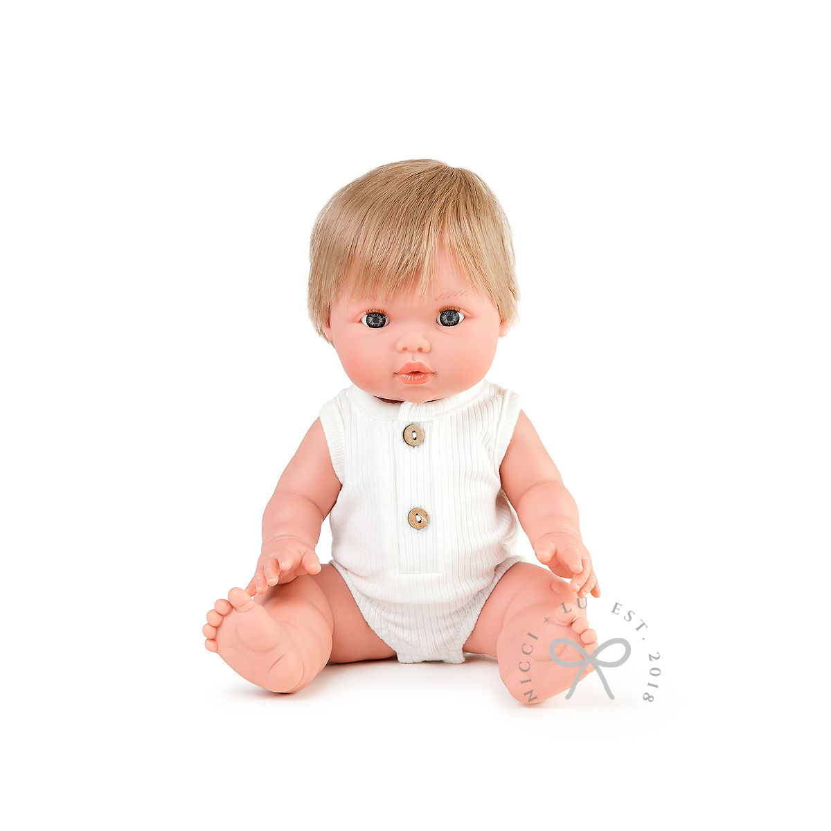 nicci and lu mini coletto oliver wearing a ribbed bubble romper in ivory 34cm doll clothing