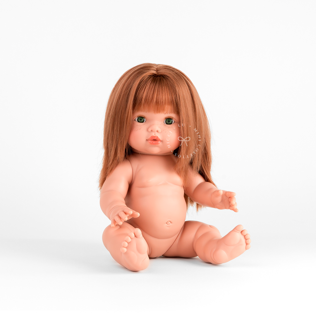 Nicole looks sweet dressed in a Mae velvet dress set in rose blush  that complements her beautiful copper-red hair. This styled photograph shows the 34cm Mini Colettos doll dressed for imaginative play and special doll adventures.