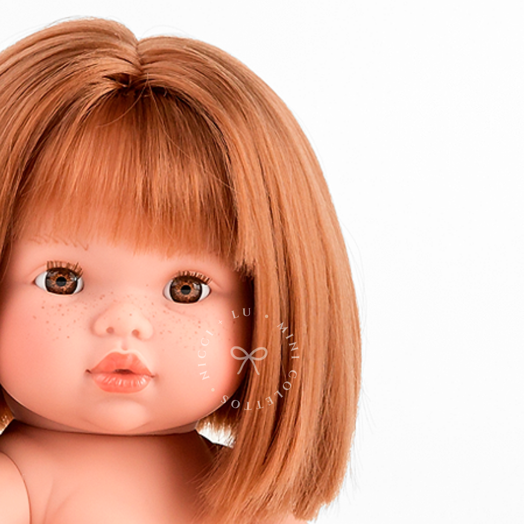 A detailed portrait of Sadie highlights her sweet freckles, expressive hazel-brown eyes and beautiful straight strawberry-blonde fringe. Her distinctive facial features and warm hair colour make this 34cm Mini Colettos doll a charming addition to a doll collection.