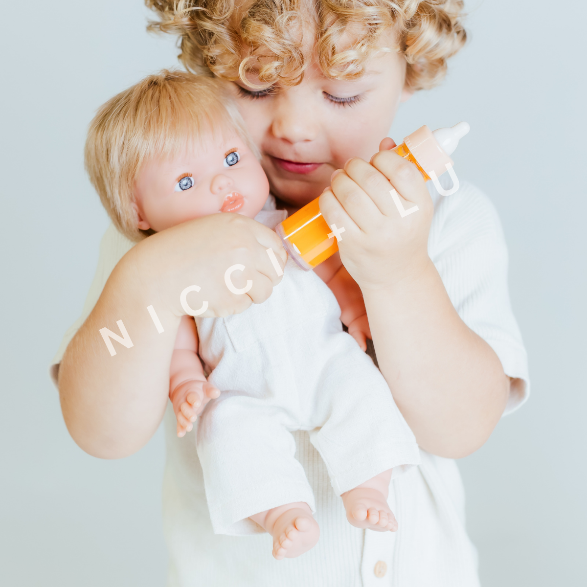 Mini Colettos 34cm doll Oliver in a little boys arms lifestyle image