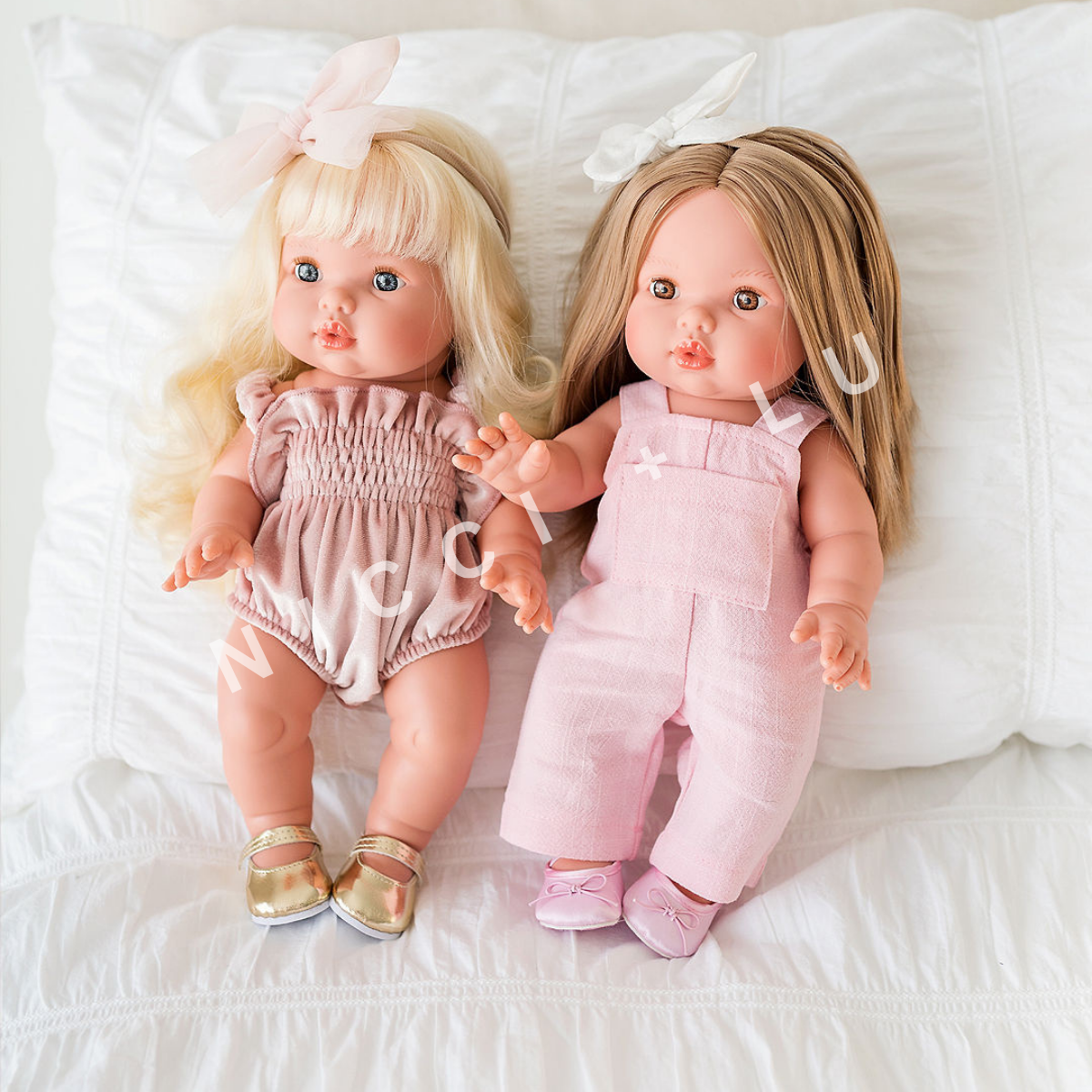 Mini Colettos Dolls Sage and Nicole wearing a 34cm Dolls velvet smocked bubble romper and a rose pink linen overall and 34cm Doll shoes .