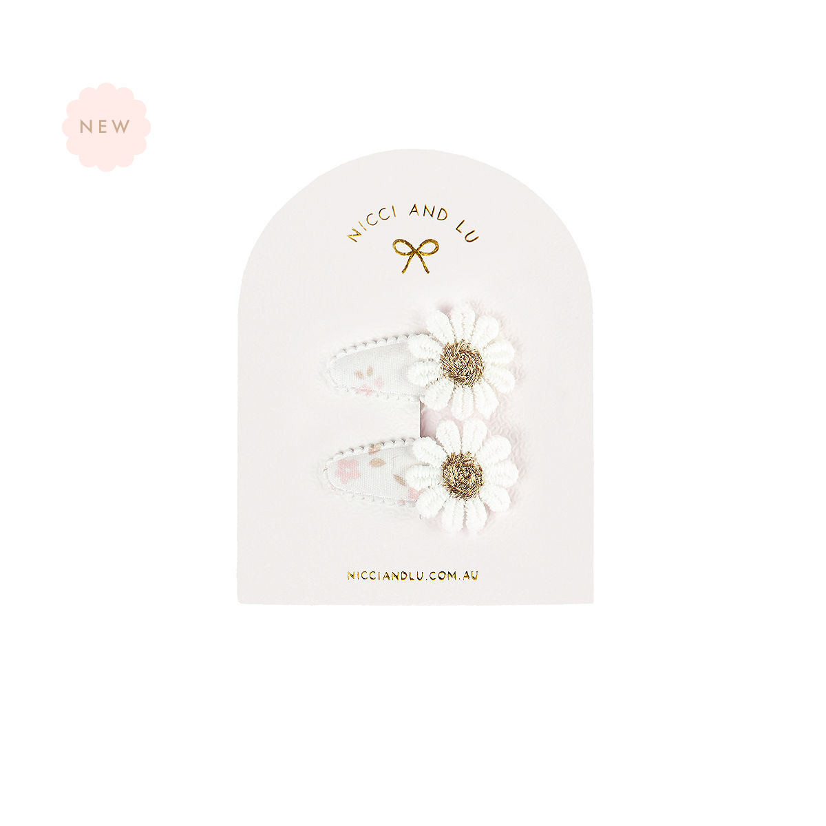 Nicci + Lu Mini Daisy Snap Clips Pair of white floral hair clips with a daisy detail in a branded card on a white background