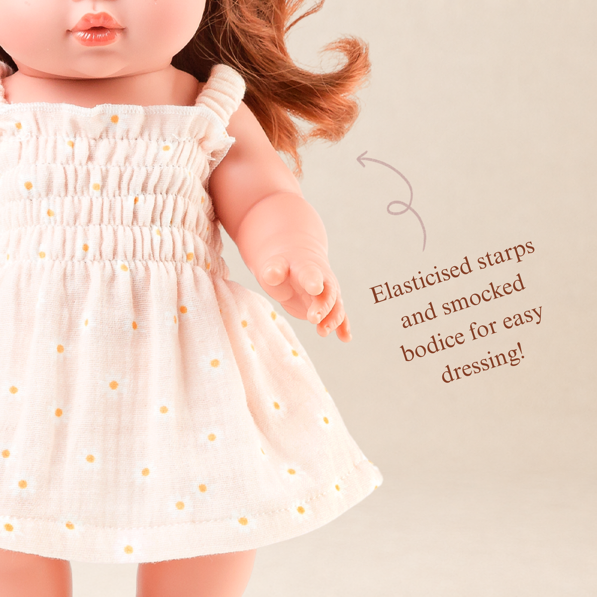 Close-up of the Billie Smocked Dress in Daisy Print Muslin highlighting the hand-smocked bodice and daisy print fabric.