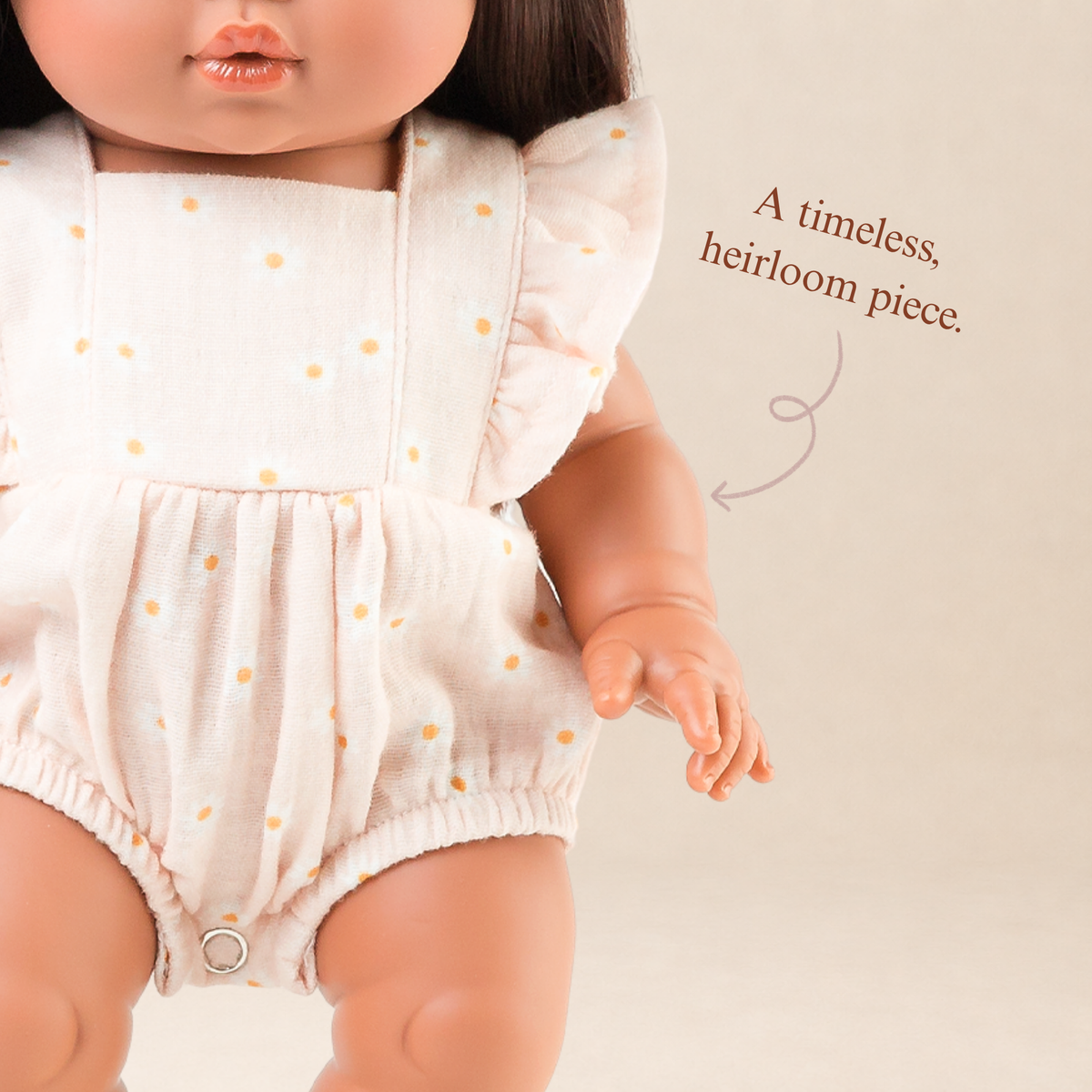 Close-up of the Elodie Frilled Bubble Playsuit in Daisy Print Muslin highlighting the gathered bodice and daisy print.