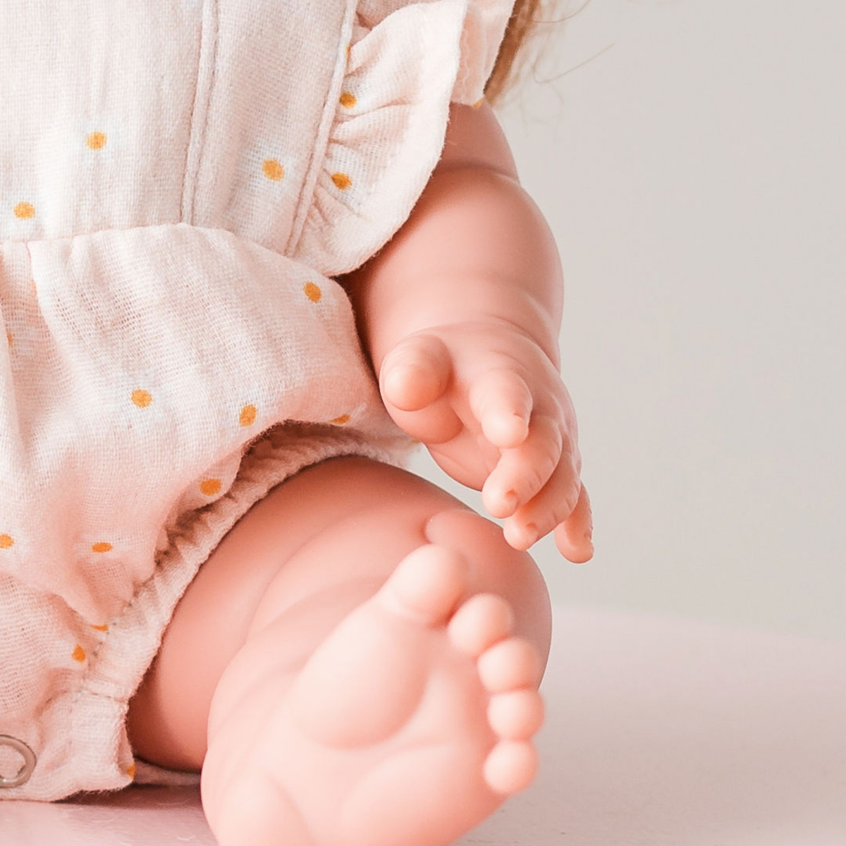 Close-up detail of the Elodie Frilled Bubble Playsuit in Daisy Print Muslin on Mini Colettos Sophia.