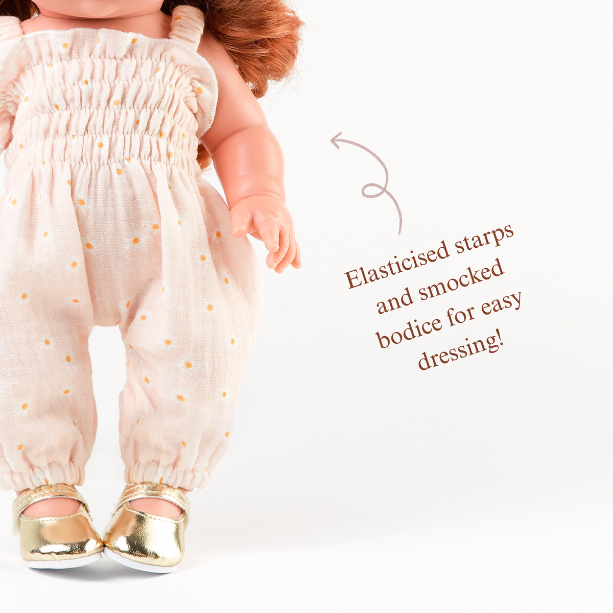Close-up of the Florence Smocked Jumpsuit in Daisy Print Muslin highlighting the smocked bodice and gathered legs.