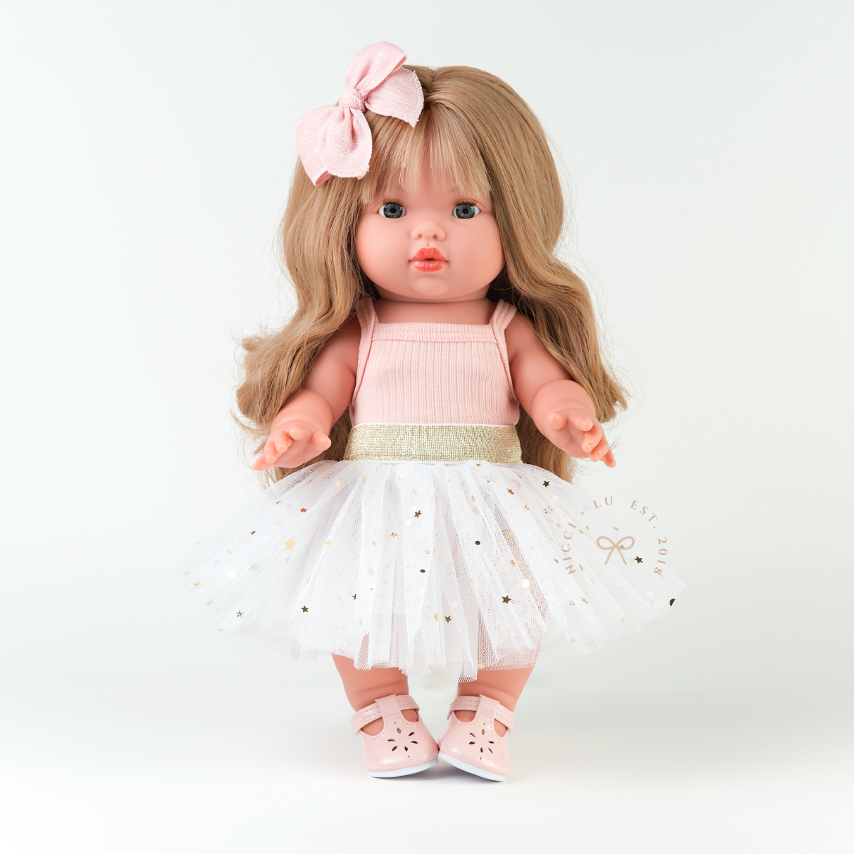 Mini Colettos Lyla doll wearing the Ivory Doll Tulle Tutu with a rose pink singlet bodysuit.