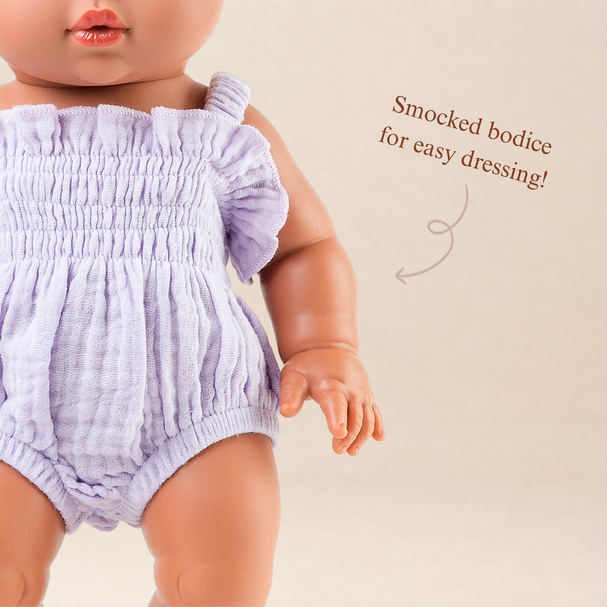 Close-up of the Olivia Smocked Bubble Romper in Lilac Gingham featuring the hand-smocked bodice and elasticised straps.