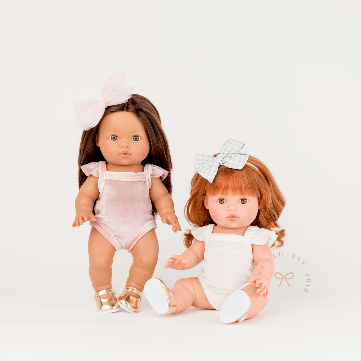 Mini Colettos Isabel and Sophia wearing Frilled Velvet Singlet Bodysuits in Ivory and Rose Blush.
