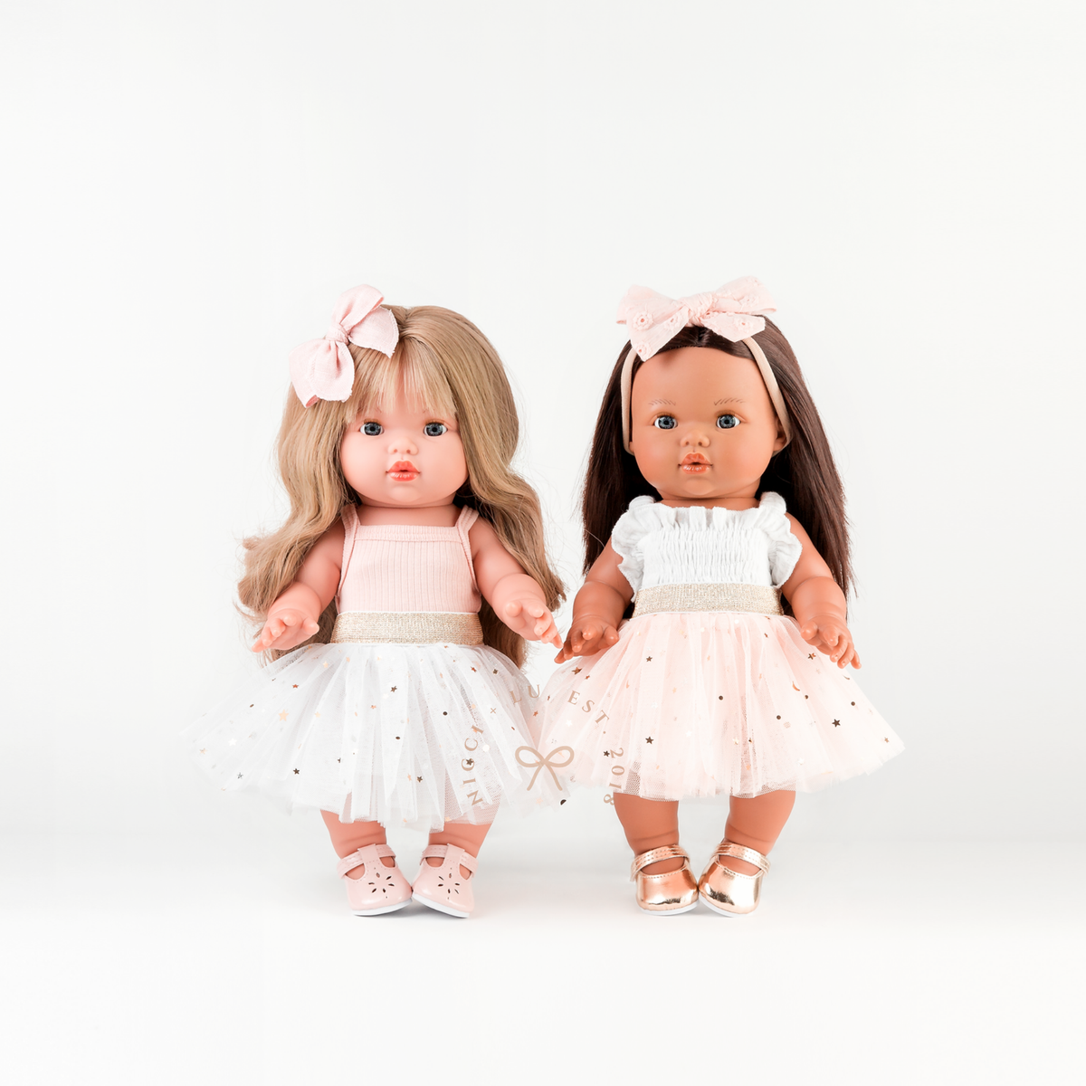 34cm Mini Colettos Lyla and Isabel dolls wearing the Ivory and Peach Tulle Tutu Skirts.