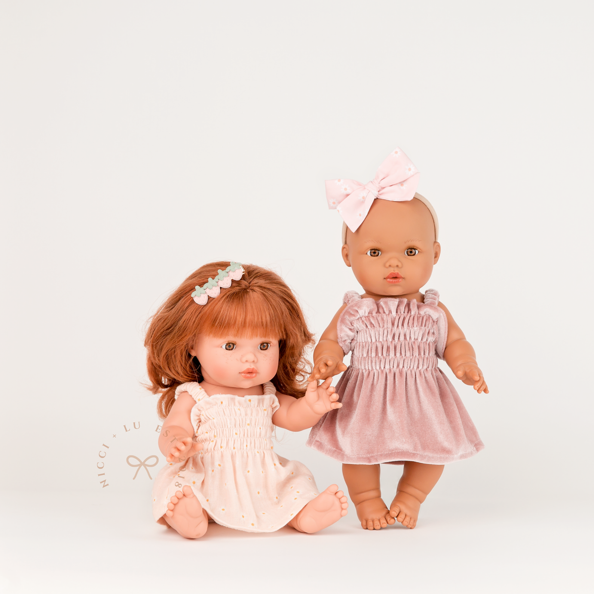 Mini Colettos Sophia and Alba wearing the Billie Smocked Dress in Rose Blush Velvet and Daisy Print Muslin.