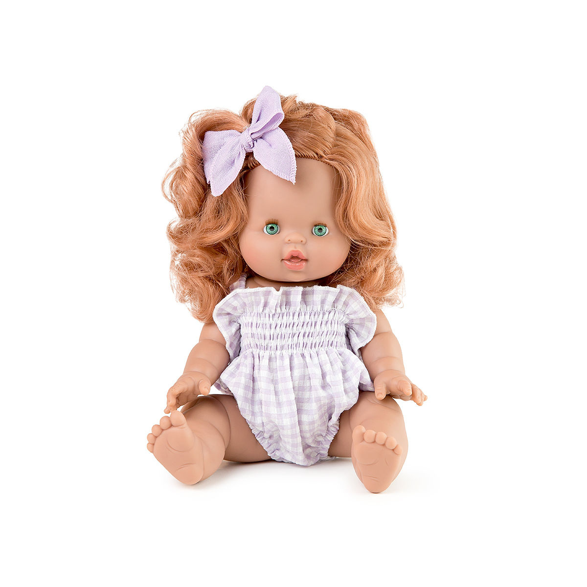 Minikane Juliette 34cm anatomically correct doll with curly strawberry blonde hair and green eyes wearing a Mauve Smock Bubble romper