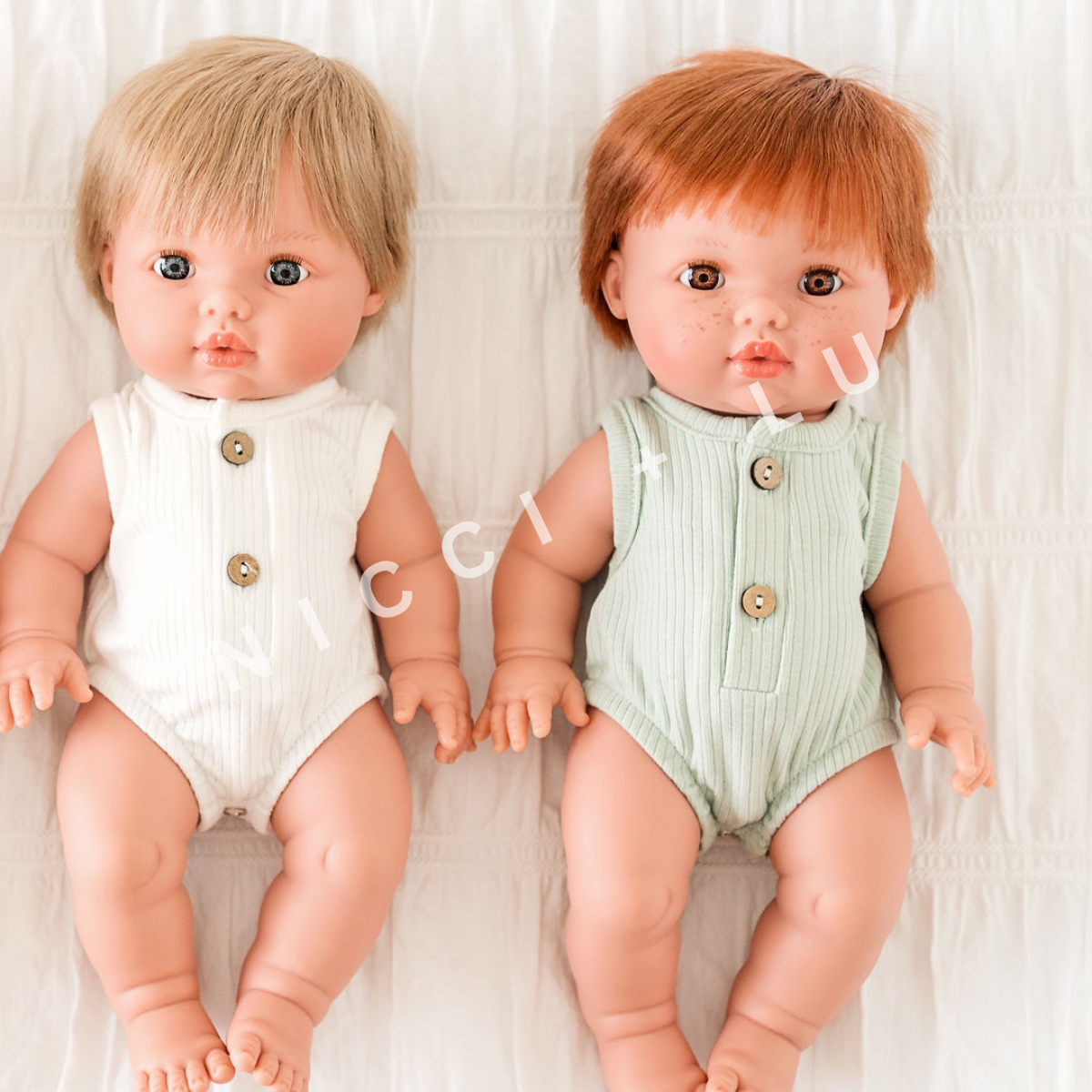 nicci and lu mini coletto doll jasper wearing a ribbed bubble romper in sage 34cm doll clothing