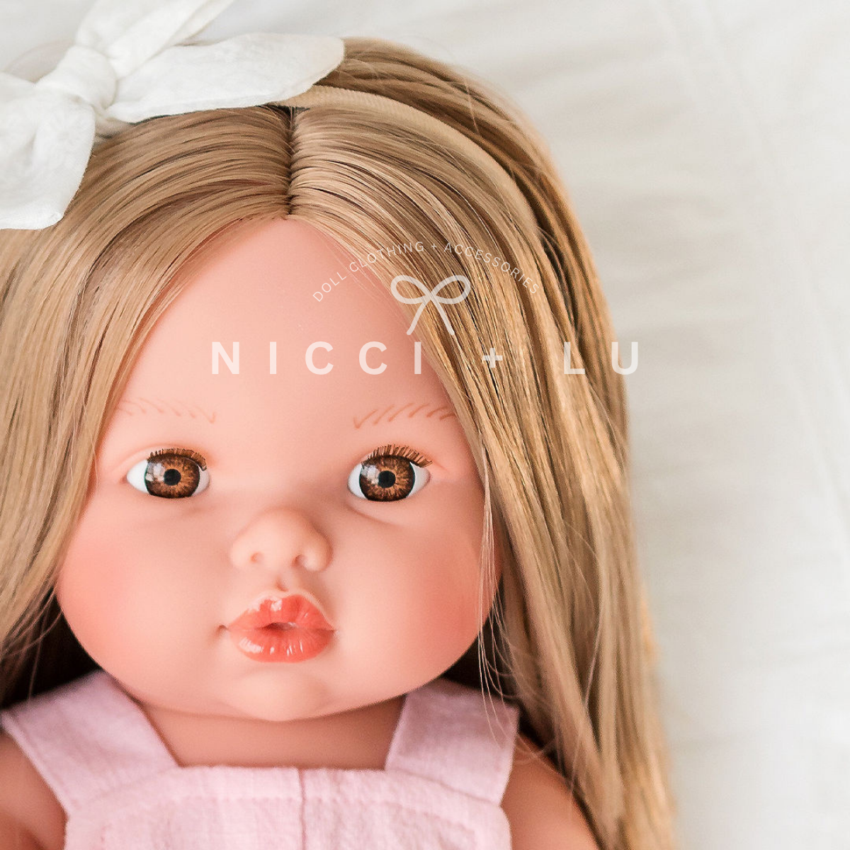 nicci and lu mini coletto sandra wearing a pink overall and white velvet bow clip 34cm doll clothing
