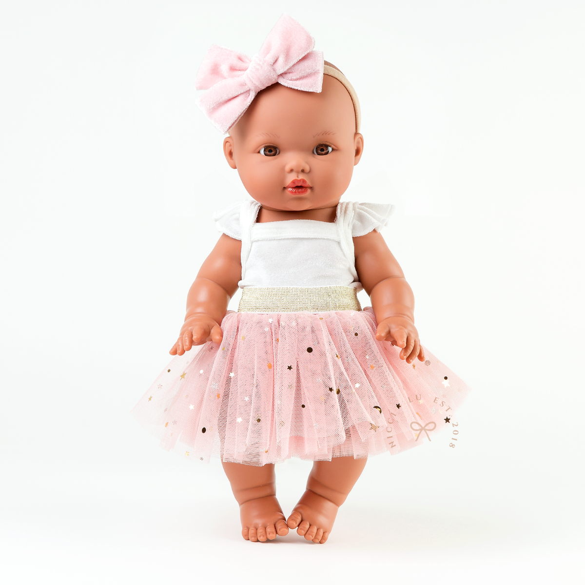 Mini Colettos doll wearing the Rose Blush Doll Tulle Tutu with a white singlet bodysuit.