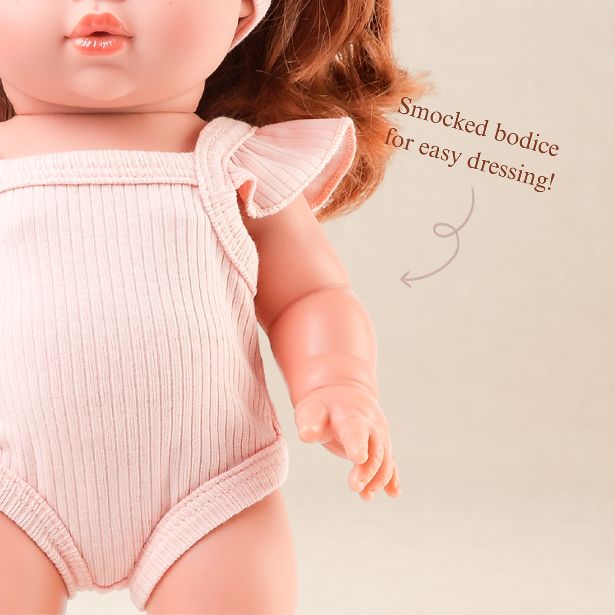 Close-up of the Rose Pink Flutter Singlet Romper showing the delicate flutter sleeves and soft fabric.