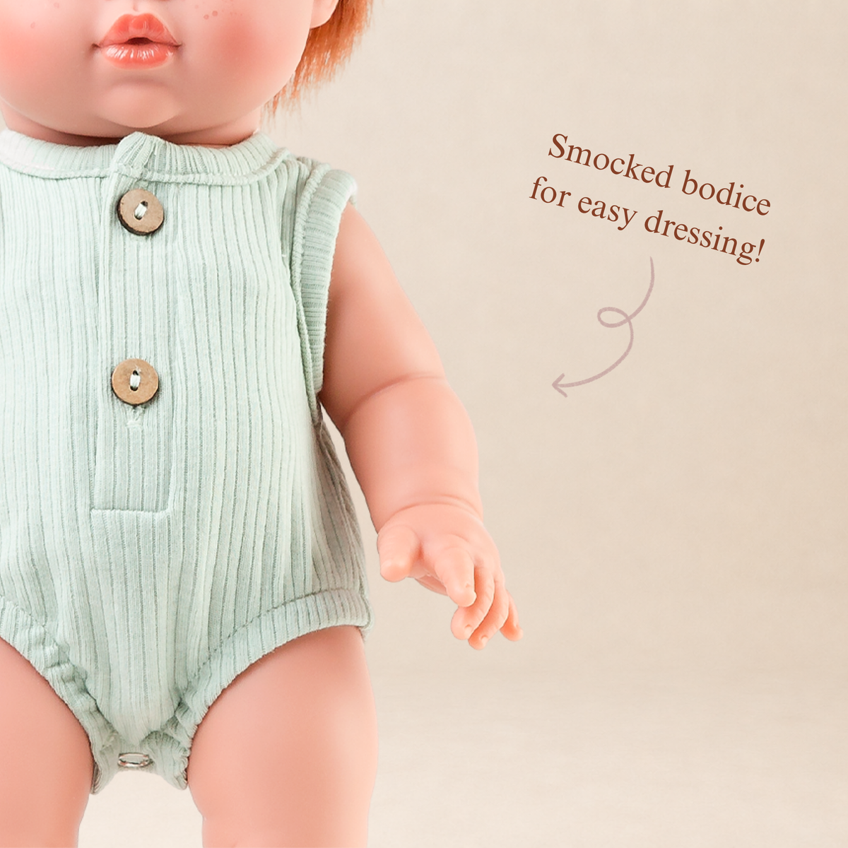 Close-up of the Sage Green Ribbed Bubble Romper showing the ribbed fabric and button details for 34-38cm dolls.