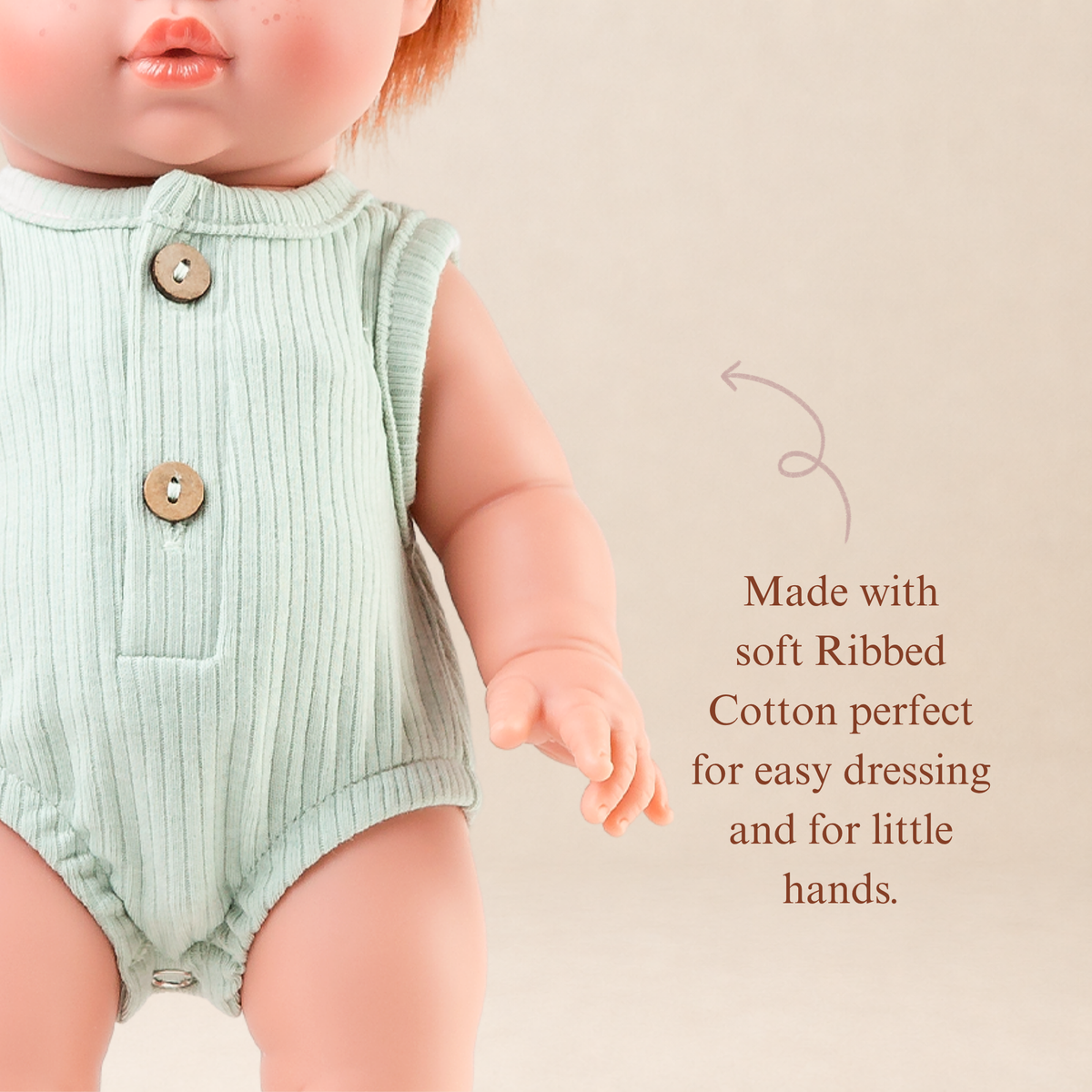 Close-up of the Sage Green Ribbed Bubble Romper showing the ribbed fabric and button details for 34-38cm dolls.