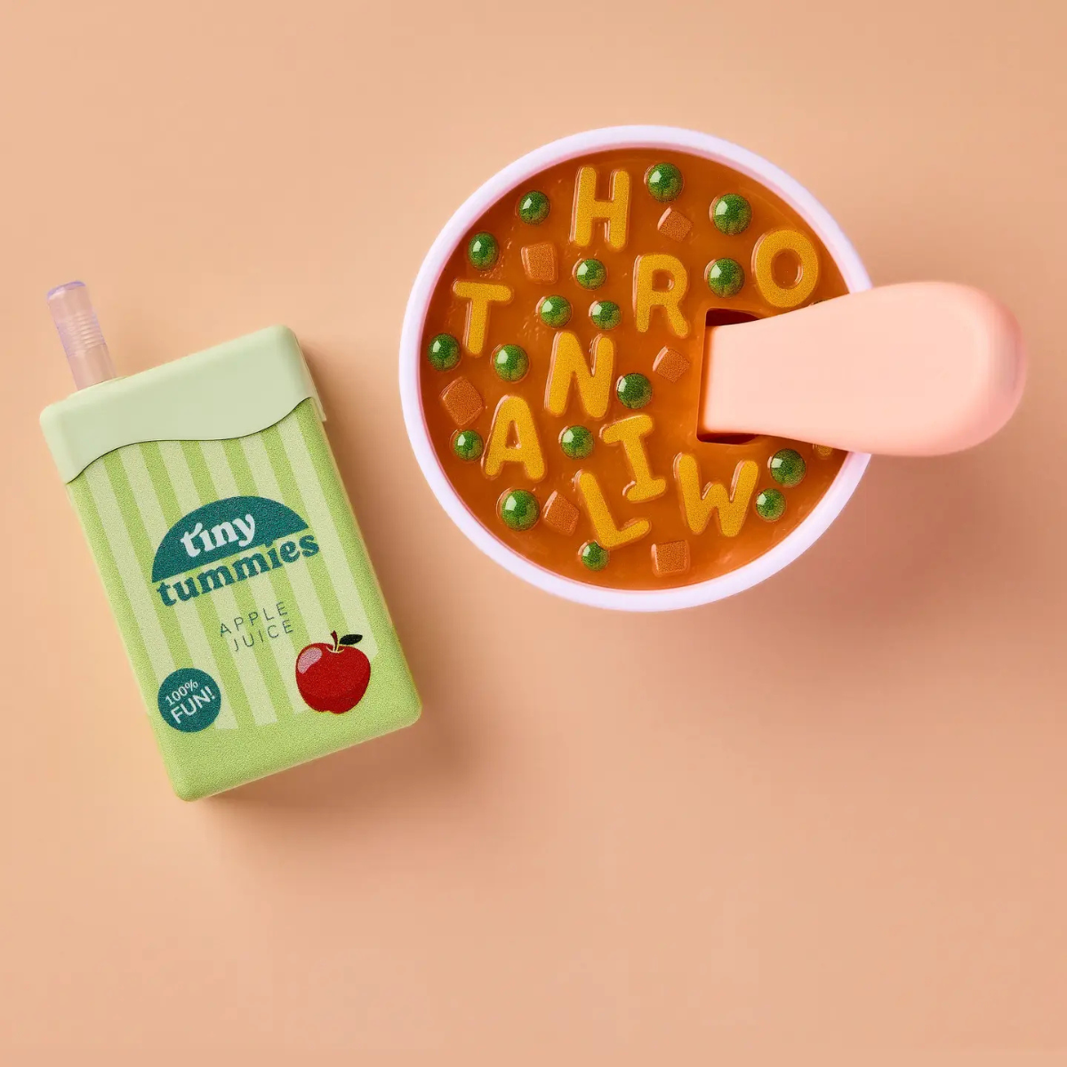 Tiny Harlow Alphabet Soup Lunch Pack displayed with green apple drink and soup bowl.