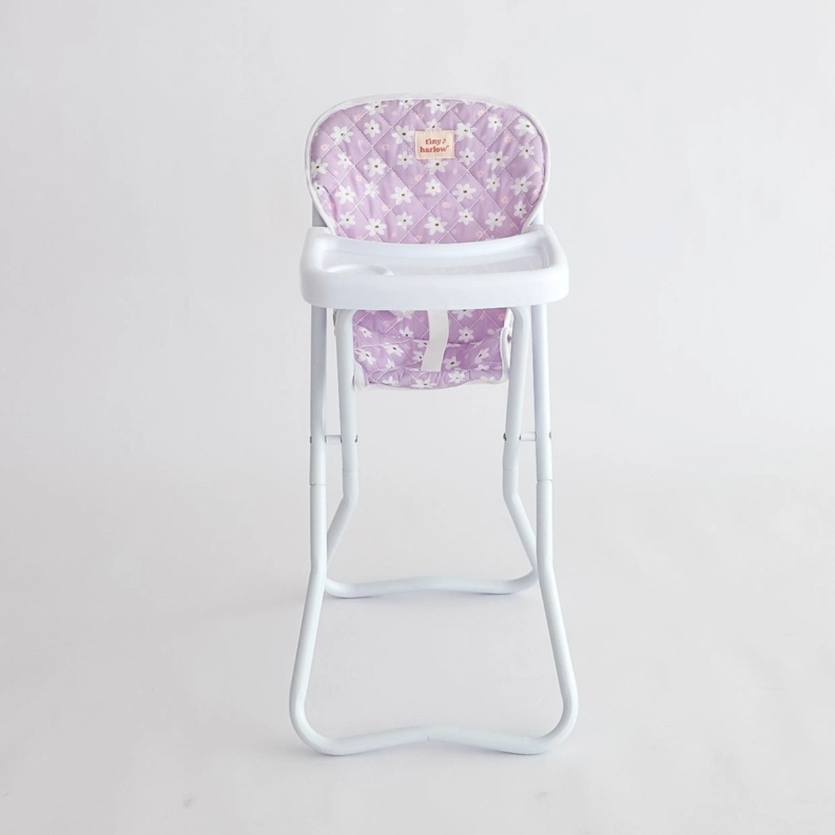 Tiny Harlow lilac daisy doll highchair shown against a white background.