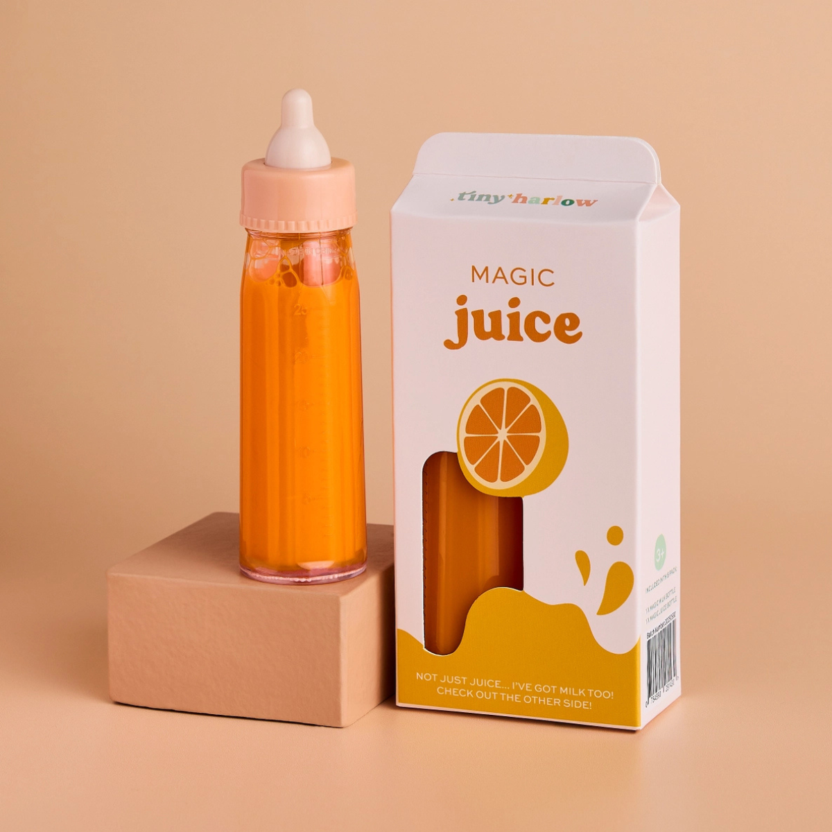 Tiny Harlow Magic Juice doll bottle displayed with its orange juice packaging