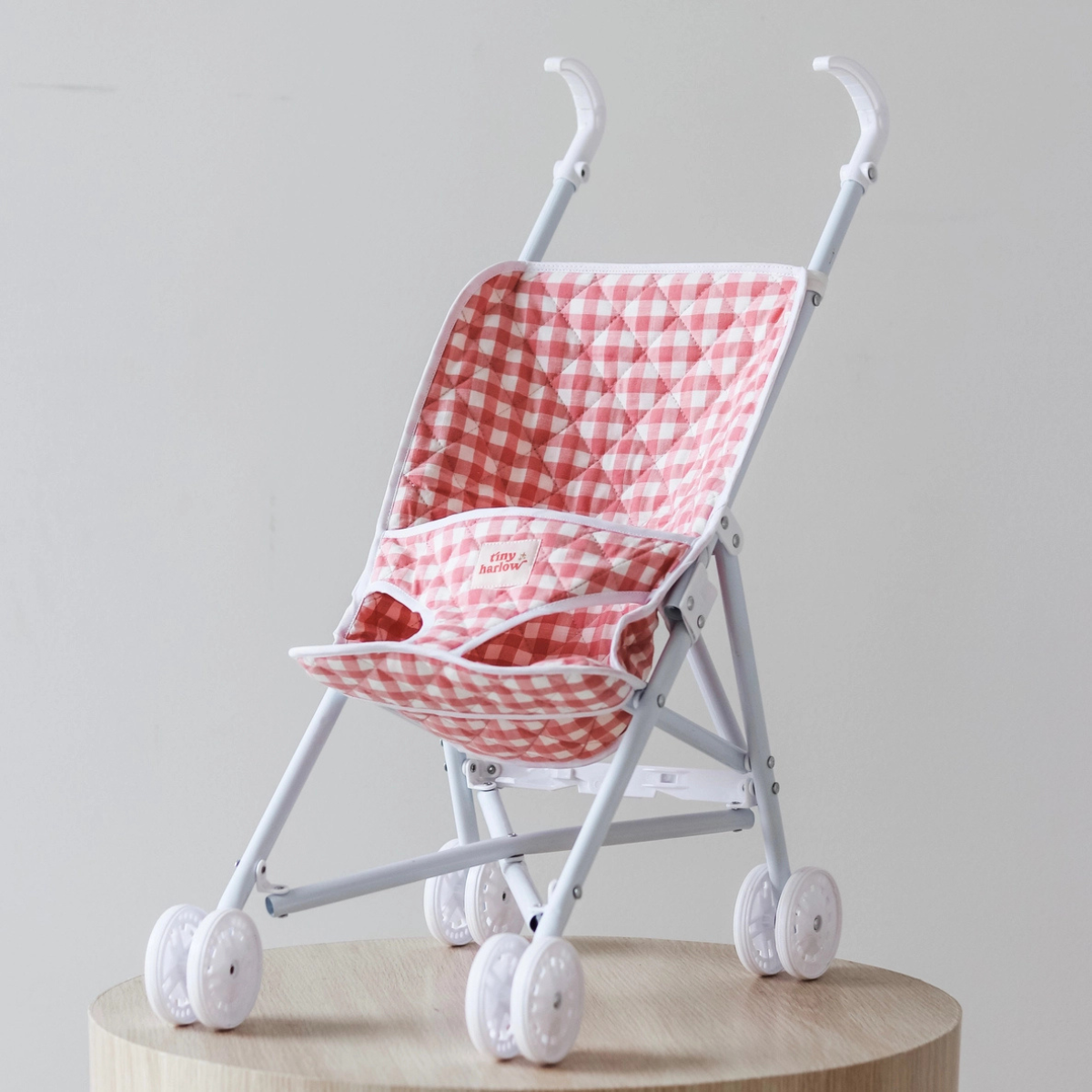 Tiny Harlow Pink Gingham Folding Doll Stroller shown from the front
