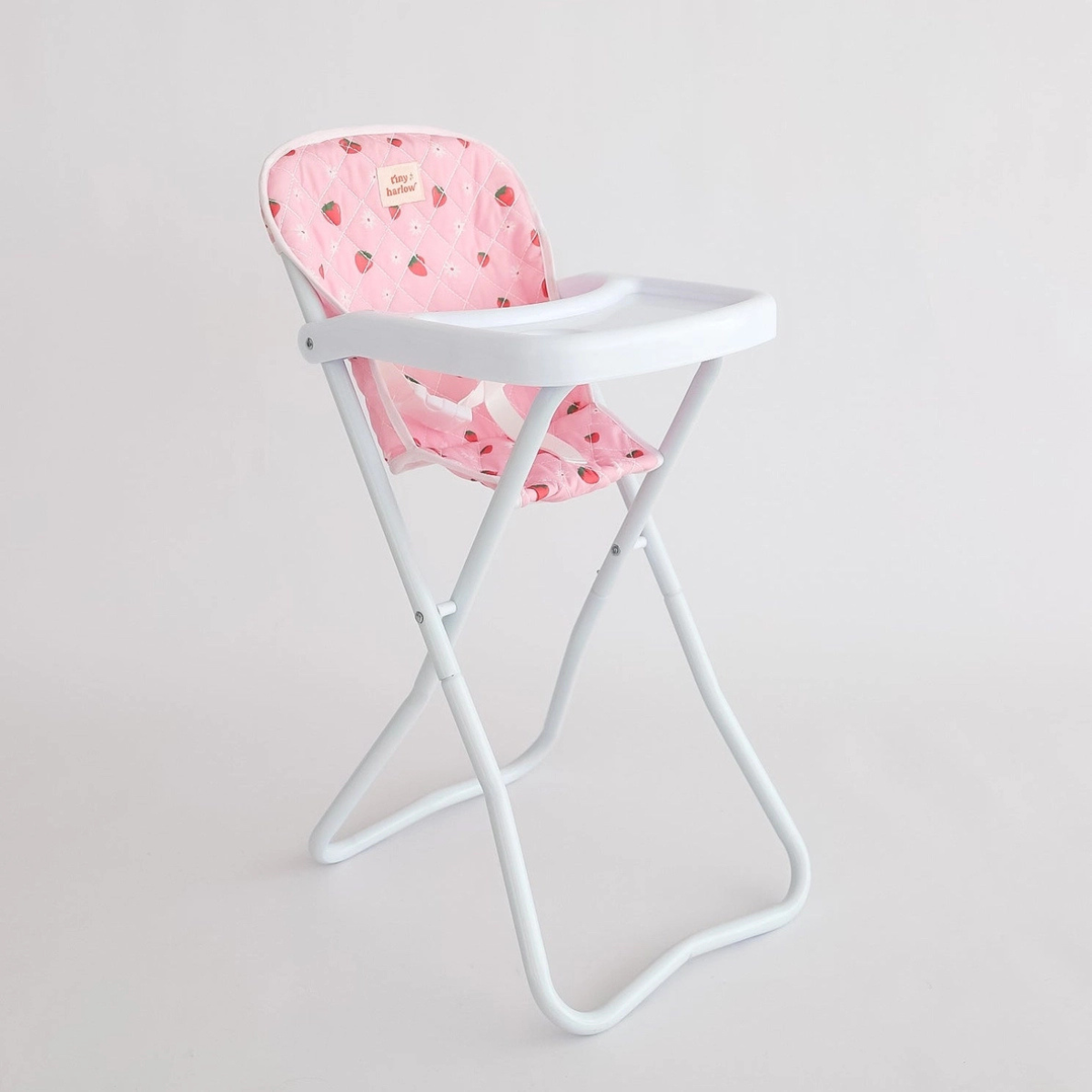 Tiny Harlow Strawberry Picnic doll highchair shown against a white background
