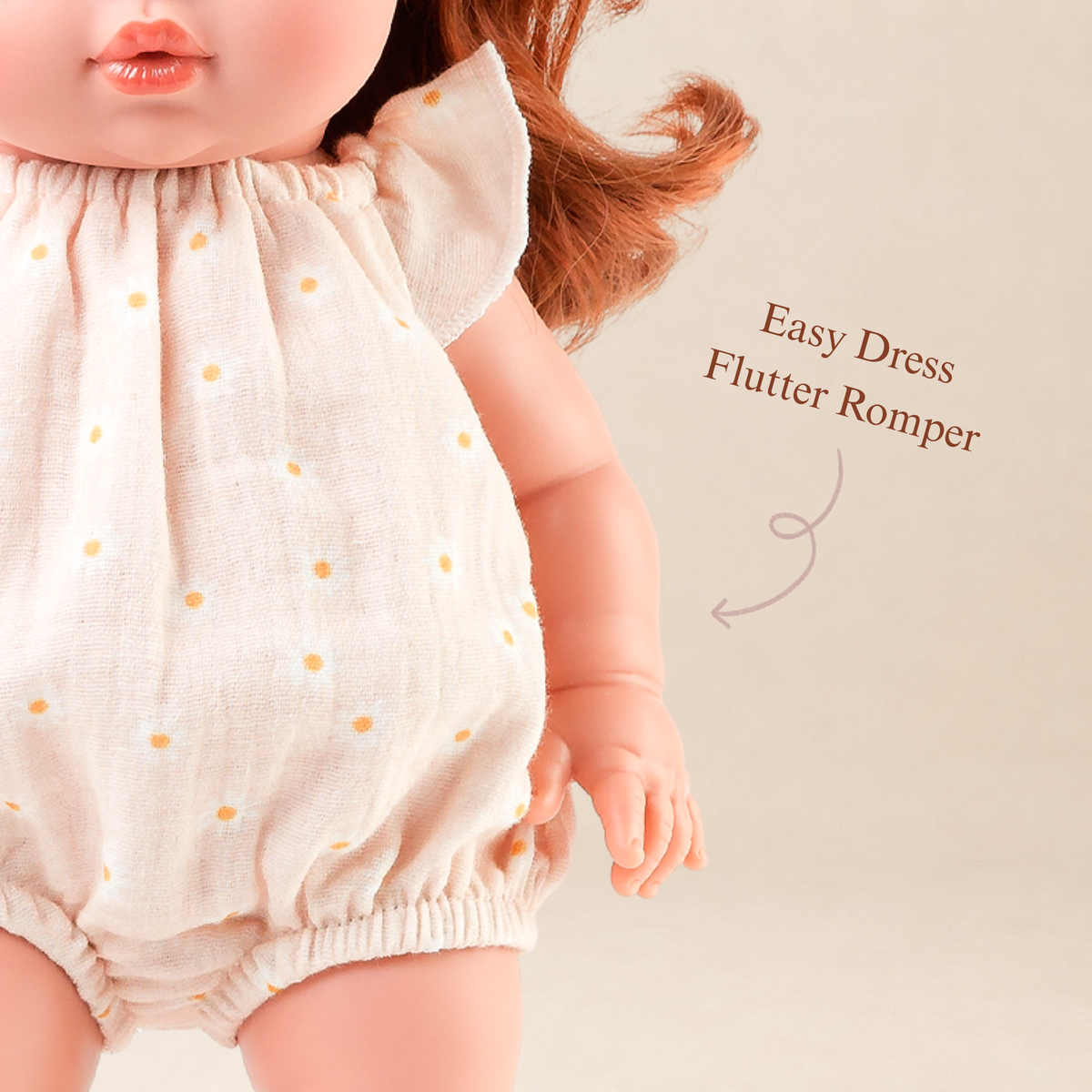 Close-up of the Willow Muslin Romper in Daisy Print highlighting the gathered neckline and daisy fabric by Nicci and Lu.